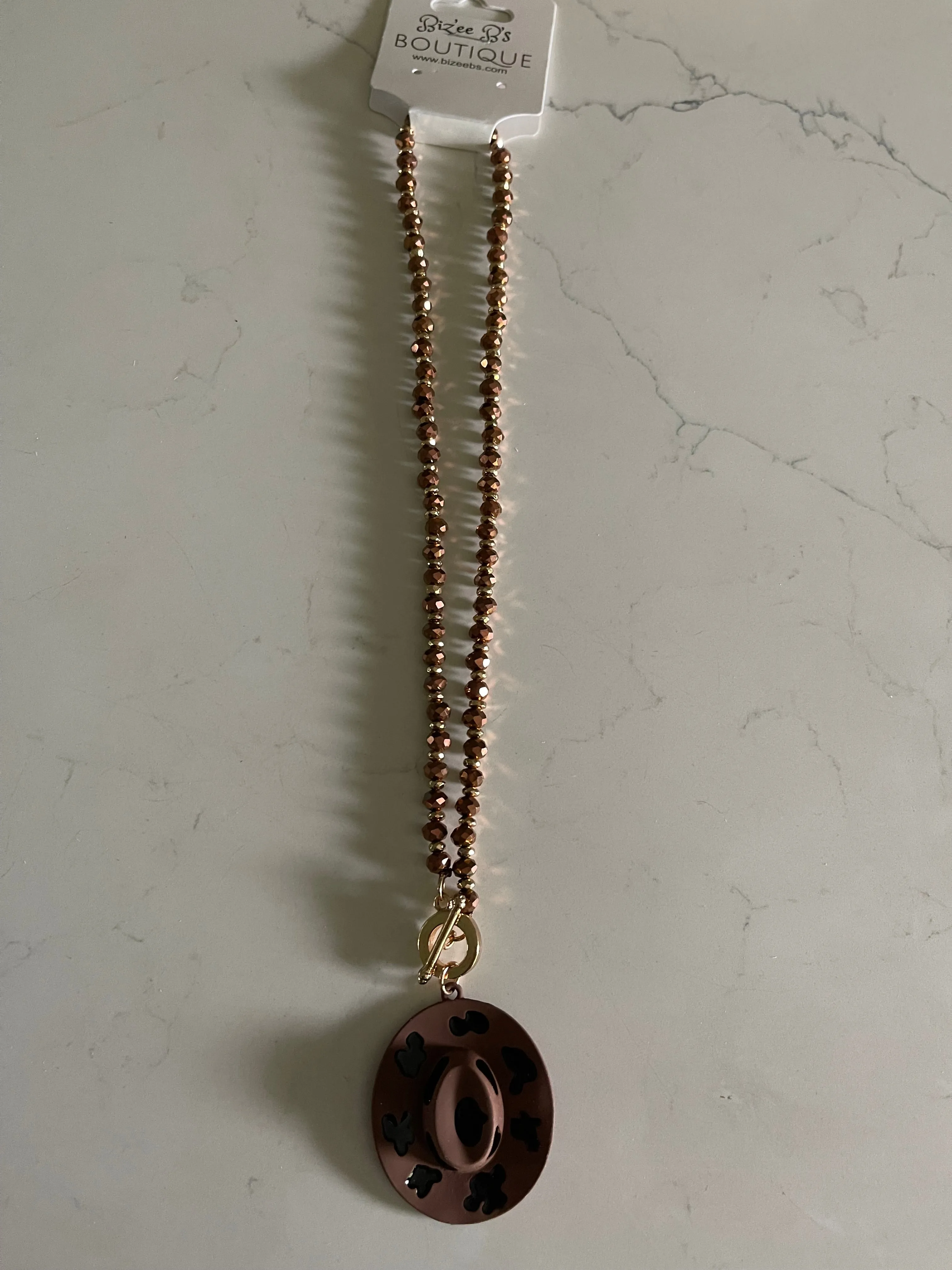 Metal Cowboy Hat with Cow Print Necklace
